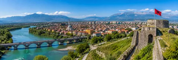 Shkodër, Albania, with Rozafa Castle overlooking the city, river, historic bridge and surrounding mountains.