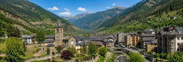 Scenic panoramic view of Ordino, Andorra, with traditional stone buildings and dramatic Pyrenean mountains
