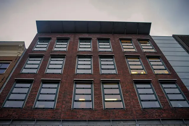 Front façade of the Anne Frank House in Amsterdam with its historic brick exterior and tall windows.