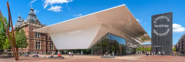 Stedelijk Museum Amsterdam with its modern white façade and historic red-brick building
