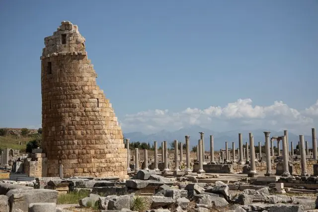 Ancient ruins of Perge with a monumental stone tower and Roman columns