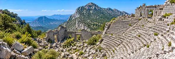Termessos Ancient City in Antalya, Türkiye, with ancient ruins and a dramatic mountain backdrop