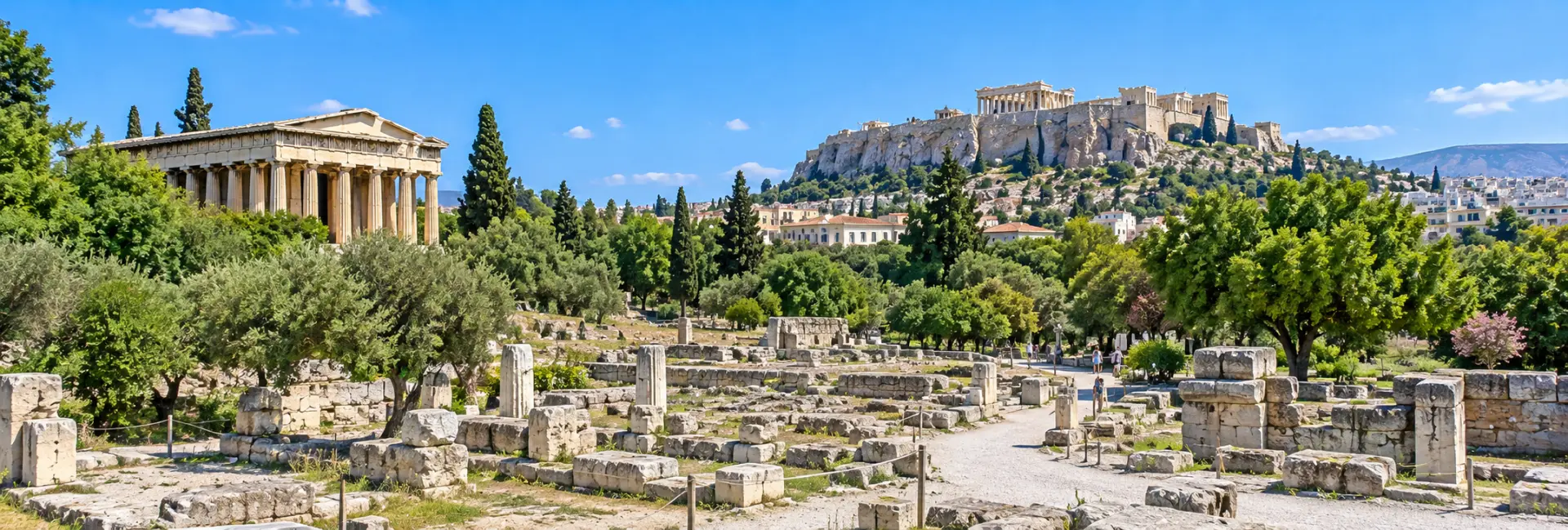 Ancient Agora of Athens, Greece, with the Temple of Hephaestus and Acropolis in the background.