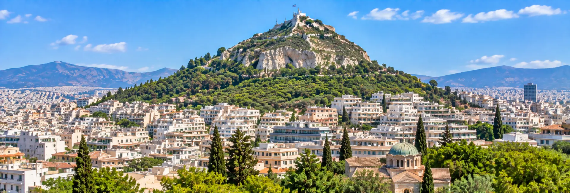 Mount Lycabettus in Athens, Greece, rising above the city with its hilltop chapel