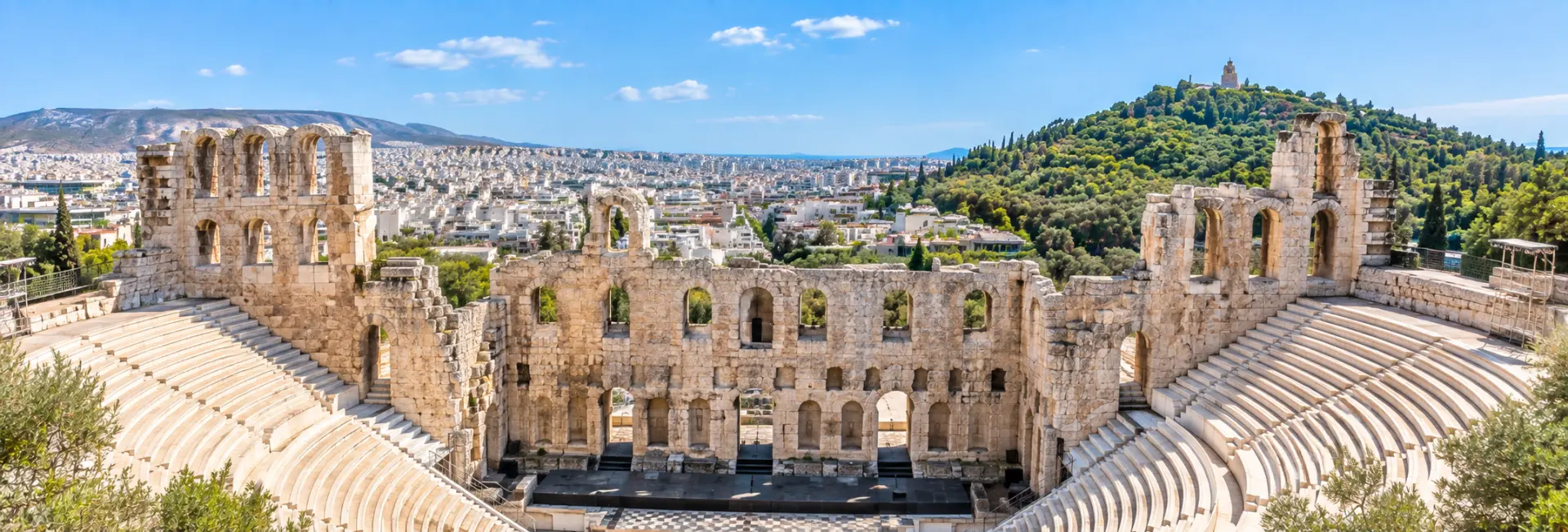 Odeon of Herodes Atticus in Athens, Greece, with ancient stone arches and semicircular seating