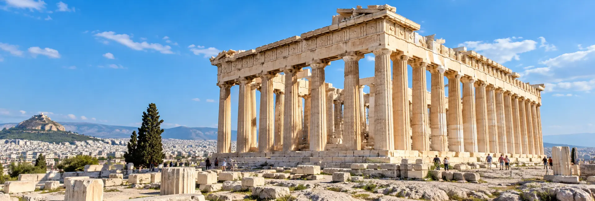 Parthenon in Athens, Greece, viewed in bright daylight above the ancient Acropolis ruins.