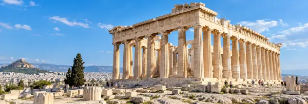 Parthenon in Athens, Greece, viewed in bright daylight above the ancient Acropolis ruins.