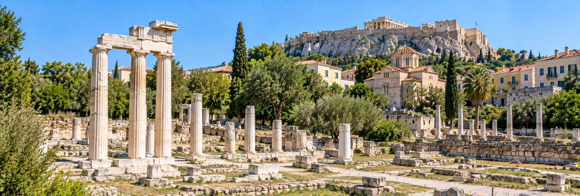Roman Agora of Athens, Greece, with ancient marble columns and the Acropolis in the background