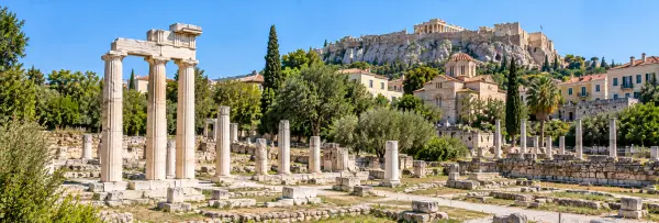 Roman Agora of Athens, Greece, with ancient marble columns and the Acropolis in the background