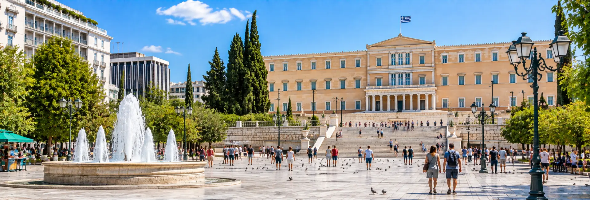 Syntagma Square in Athens, Greece, with the Hellenic Parliament, fountain, and surrounding greenery