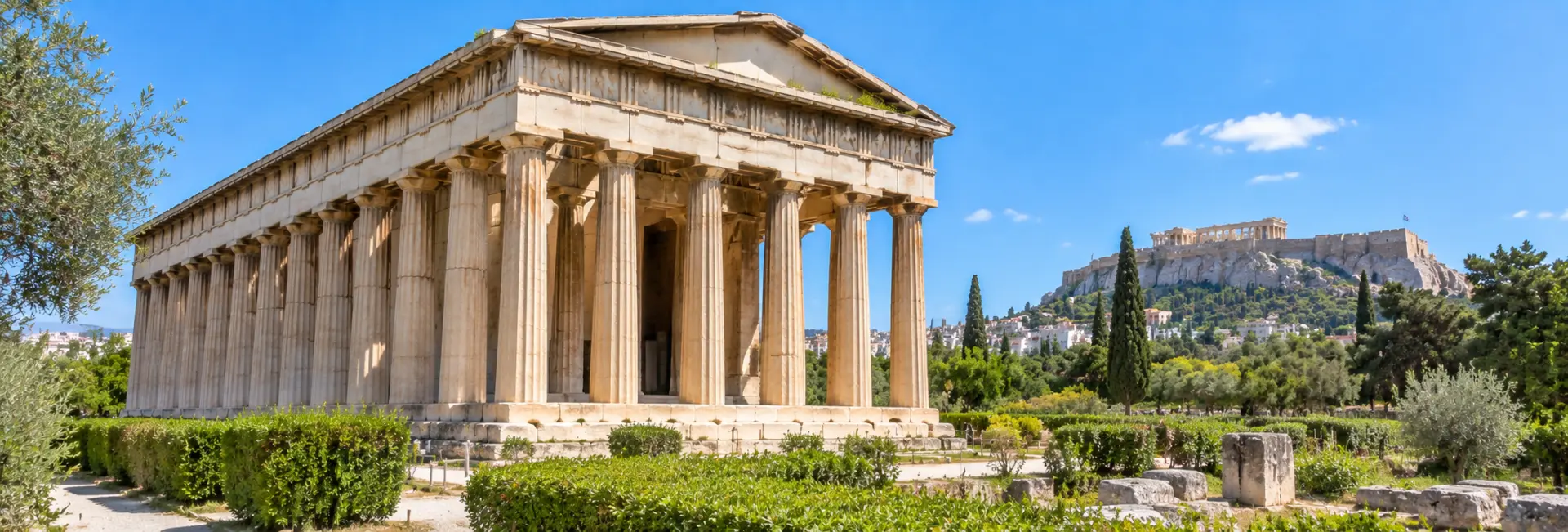 Temple of Hephaestus in Athens, Greece, with ancient Doric columns and the Acropolis in the background