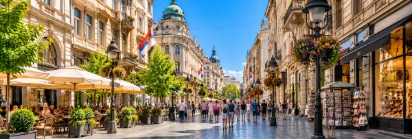 Knez Mihailova Street in Belgrade, Serbia, featuring historic buildings, lively cafes, shops and pedestrians.