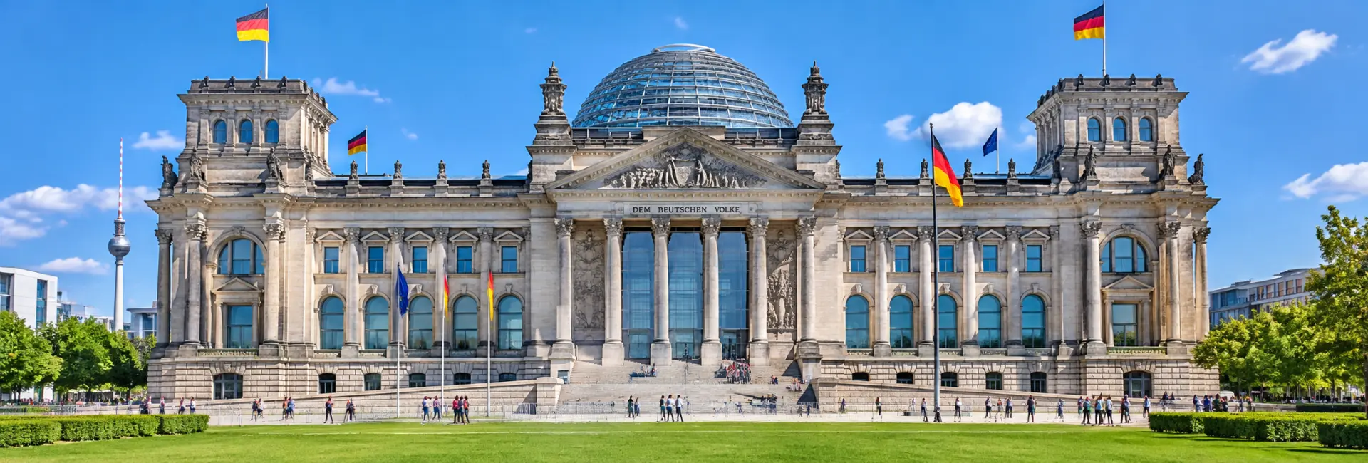 Reichstag Building in Berlin with its glass dome under a clear blue sky