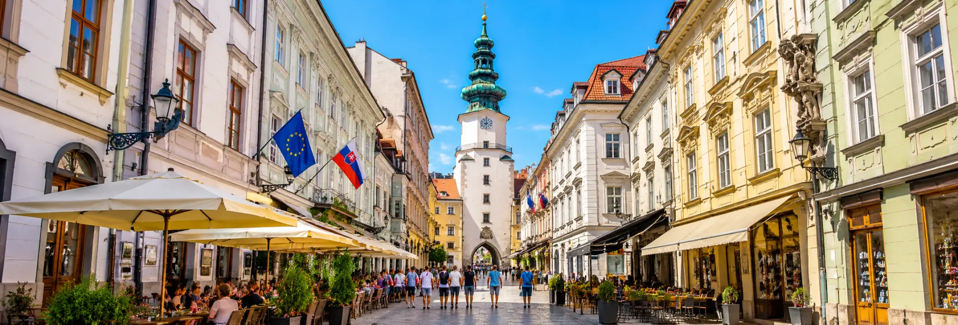 Michael’s Gate with its historic clock tower and green spire in Bratislava Old Town, Slovakia.
