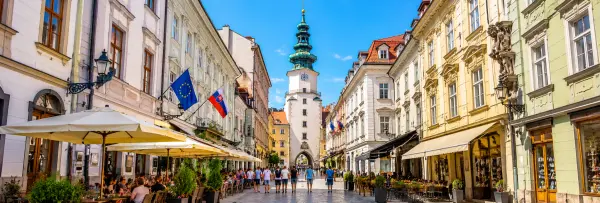 Michael’s Gate with its historic clock tower and green spire in Bratislava Old Town, Slovakia.