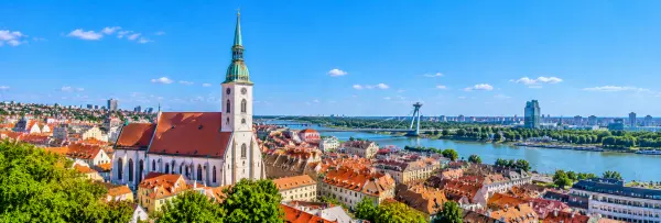 Panoramic view of St. Martin’s Cathedral with its Gothic spire overlooking Bratislava Old Town and the Danube River.