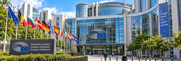 European Parliament in Brussels, Belgium, with modern architecture and European flags