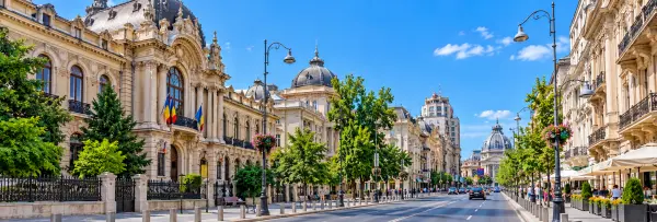Calea Victoriei in Bucharest, Romania, featuring historic buildings, elegant architecture, and a lively boulevard.