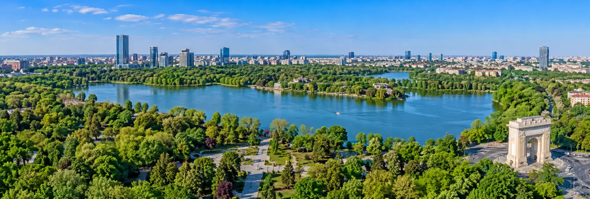 Aerial view of Herăstrău Park (King Michael I Park), featuring its lake and green spaces in Bucharest, Romania.
