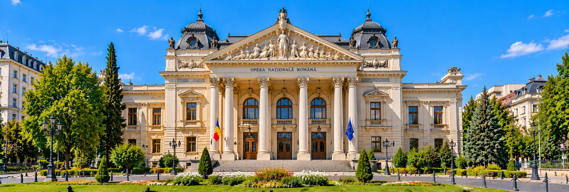 Romanian National Opera in Bucharest, Romania, featuring its grand facade, classical columns and landscaped gardens.