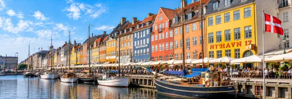 Nyhavn in Copenhagen, Denmark, with colorful historic houses and boats along the canal