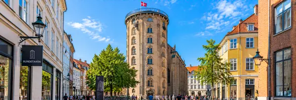 Round Tower in Copenhagen, Denmark, with its historic brick tower and surrounding city streets