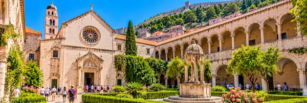 Franciscan Monastery in Dubrovnik, Croatia, featuring its historic cloister, arches and peaceful courtyard.