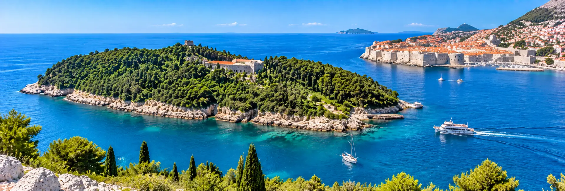 Lokrum Island near Dubrovnik, Croatia, with lush greenery, rocky shores and the blue Adriatic Sea.