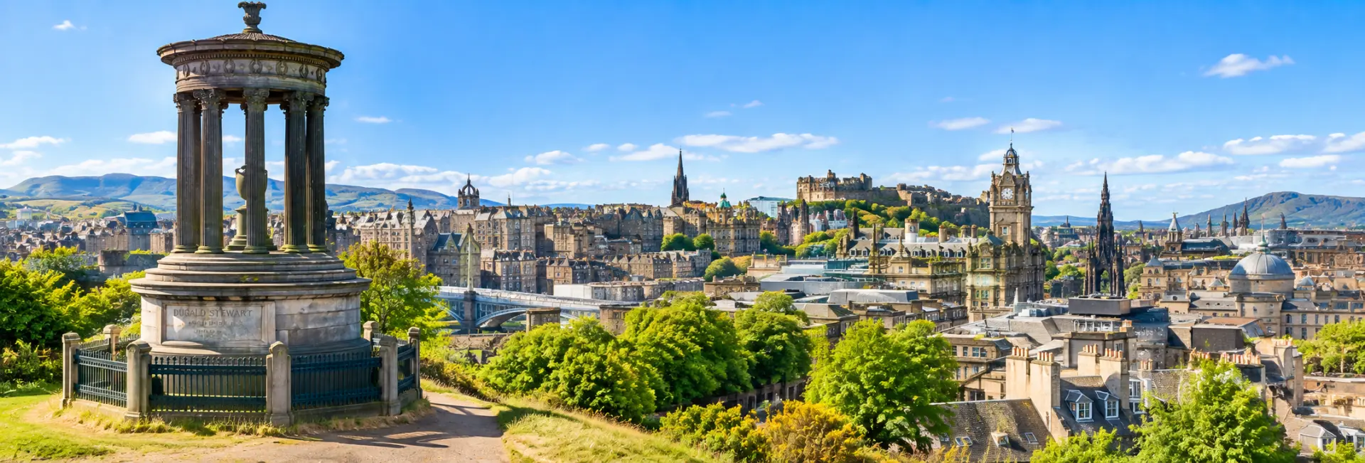 Calton Hill overlooking Edinburgh with the Dugald Stewart Monument and historic city skyline