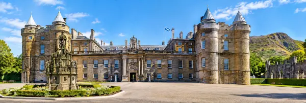 Palace of Holyroodhouse in Edinburgh with its historic sandstone façade and surrounding gardens