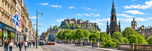 Princes Street in Edinburgh with Edinburgh Castle, Scott Monument and historic city buildings