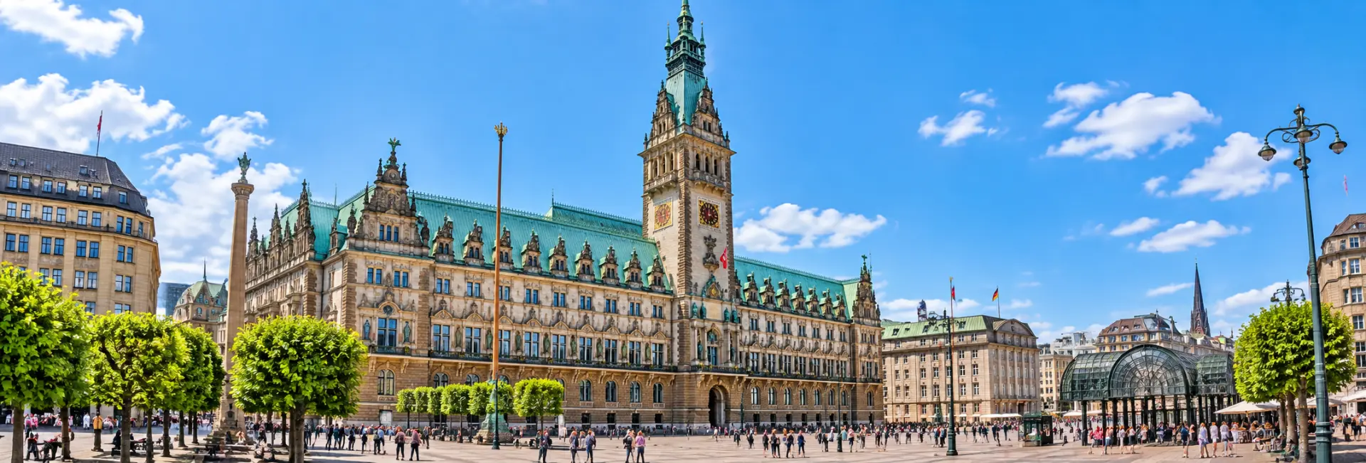 Hamburg Rathaus in Hamburg, Germany with its ornate façade, clock tower and Rathausmarkt