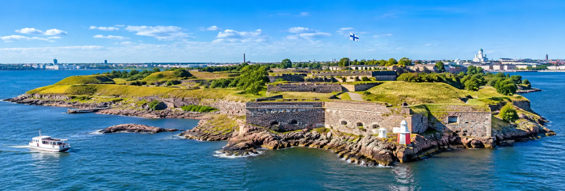 Suomenlinna Sea Fortress surrounded by blue waters in Helsinki, Finland