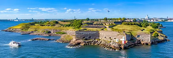 Suomenlinna Sea Fortress surrounded by blue waters in Helsinki, Finland