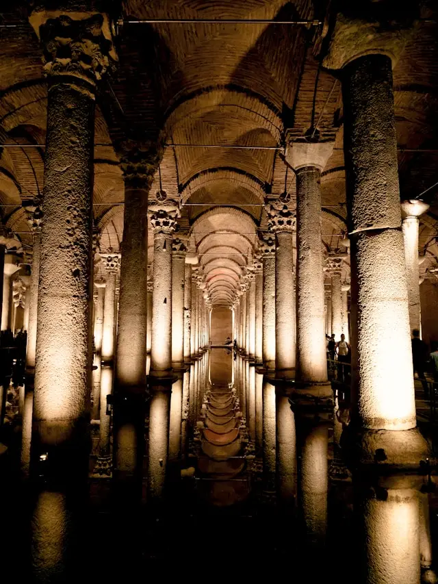 Basilica Cistern with rows of ancient columns reflected in its underground water.