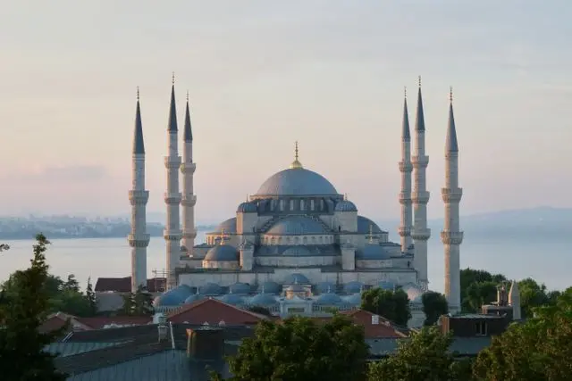 Blue Mosque in Istanbul overlooking the Bosphorus at sunset.