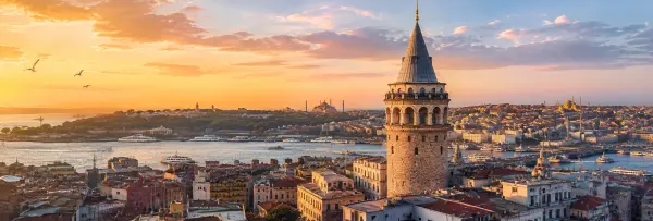 Galata Tower overlooking Istanbul’s historic skyline and Bosphorus at golden hour.