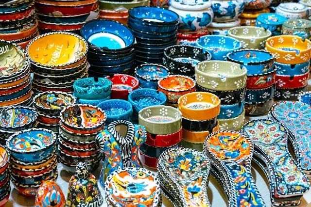 Colorful Turkish ceramic bowls and pottery displayed in Istanbul’s Grand Bazaar.
