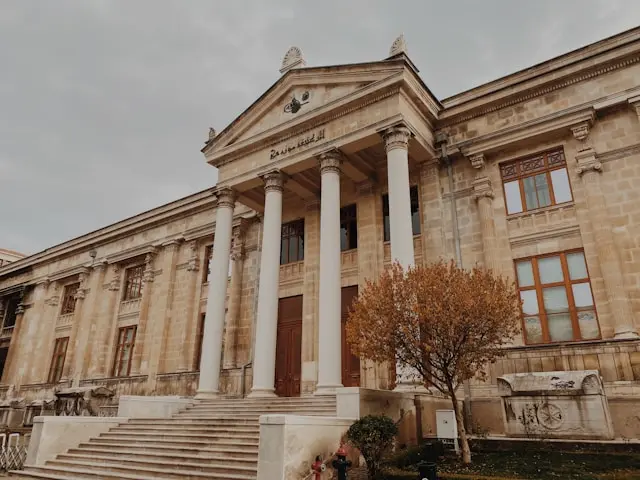 Neoclassical façade of Istanbul Archaeological Museums with grand columns and steps.