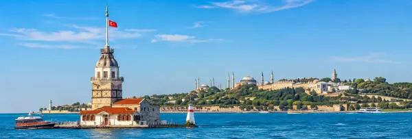 Maiden’s Tower on the Bosphorus with Istanbul’s historic skyline in the background.
