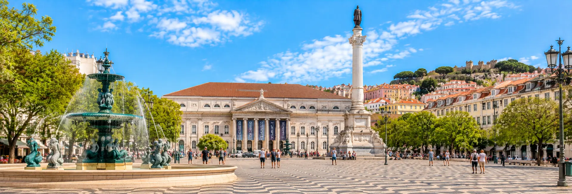 Rossio Square in Lisbon, Portugal, with its wave-patterned pavement and historic National Theatre.