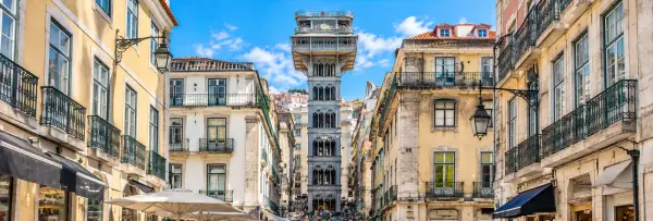 Santa Justa Lift in Lisbon, Portugal, rising above historic streets with ornate ironwork and traditional buildings.