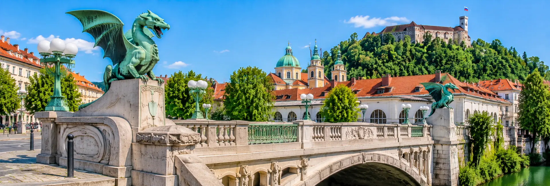 Dragon Bridge in Ljubljana, Slovenia, featuring its famous green dragon statues over the Ljubljanica River.