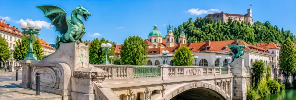 Dragon Bridge in Ljubljana, Slovenia, featuring its famous green dragon statues over the Ljubljanica River.