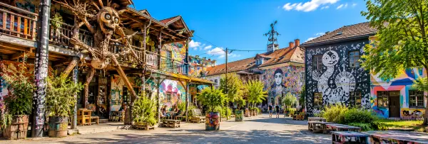 Metelkova Art Center in Ljubljana, Slovenia, featuring colorful street art, graffiti murals and creative installations.