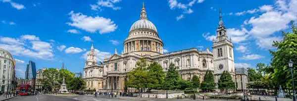 St. Paul’s Cathedral in London with its iconic dome under a bright blue sky