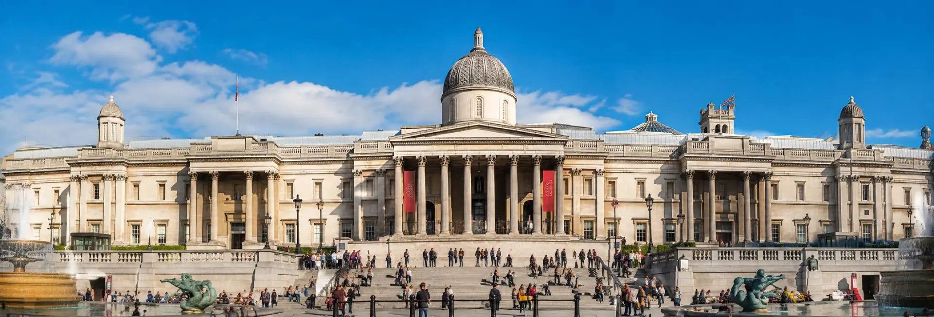 The National Gallery overlooking Trafalgar Square in London on a bright sunny day