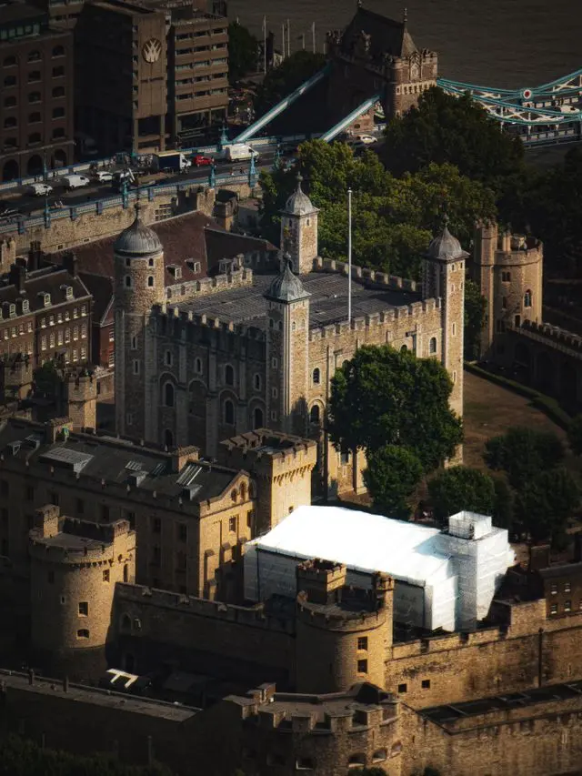 Aerial view of the Tower of London with Tower Bridge and the River Thames in London.