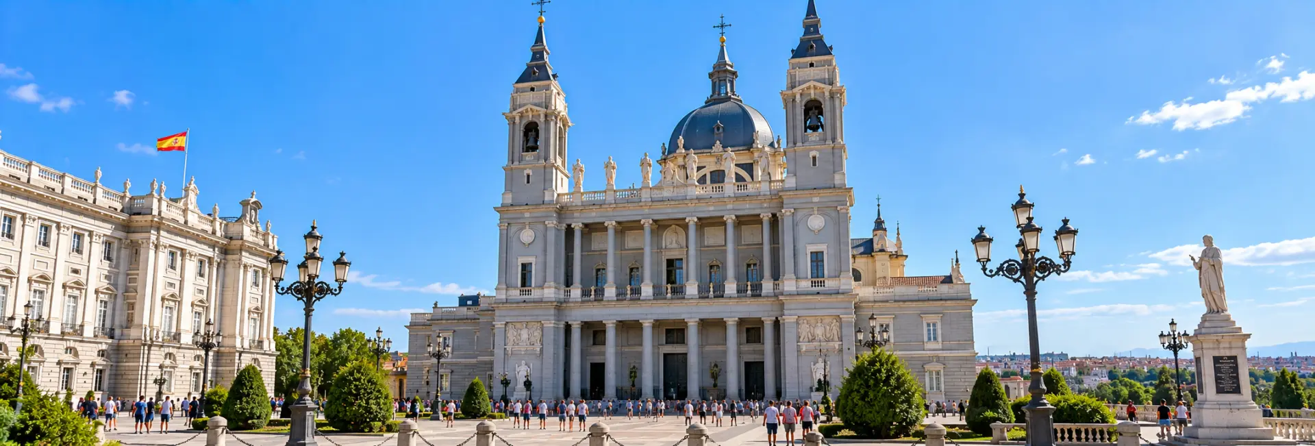 Almudena Cathedral in Madrid with its grand façade, dome, towers, and surrounding plaza