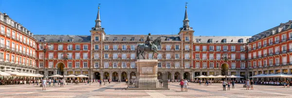 Plaza Mayor in Madrid with historic red façades and the central equestrian statue